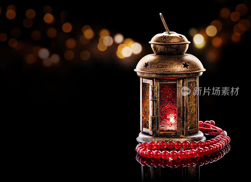 Vintage lantern with red prayer beads